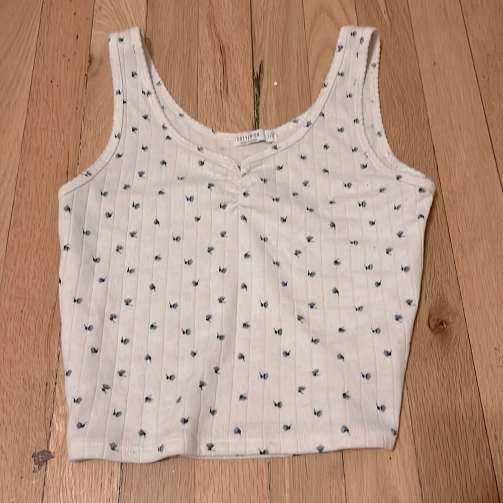 White with little blue flowers. I love this shirt!!!!
